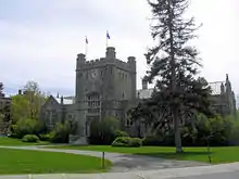 Exterior of building constructed similarly to a Scottish castle in Tudor Revival architecture