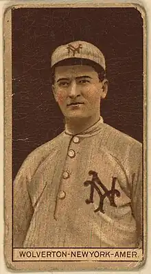 A baseball card image of a man wearing an old-style white baseball uniform and cap with an interlocking "NY" on both