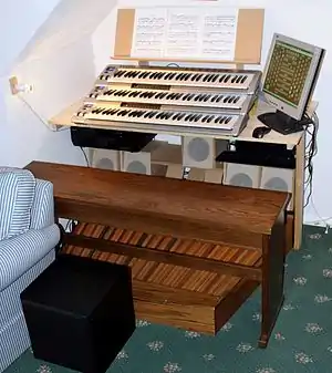 A picture of a Hauptwerk console in a domestic setting