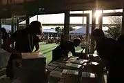 Workers prep books for signing at the bookstore