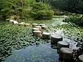 Stepping stones in the garden of the first Kyoto Imperial Palace. These stones were originally part of a 16th-century bridge over the Kamo River, which was destroyed by an earthquake.