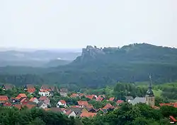 View from the Ziegenberg with the village of Heimburg in the foreground to the ruins of Regenstein Castle on the northwestern spur of the Regenstein