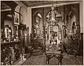 Drawing room of Henry Gibson (c. 1870), Philadelphia, Pennsylvania. The Neo-Grec center table is now in the collection of the Detroit Institute of Arts.