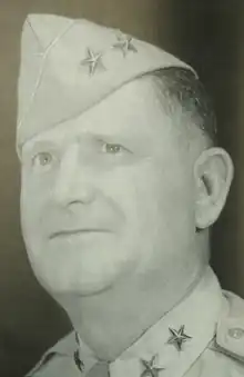 Black and white head and neck left profile photo of Major General Herman F. Kramer in dress uniform and cap