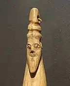 Hippopotamus tusk with carved head of a bearded man with torus-like headgear, Late Naqada I – Early Naqada II, 3800–3400 BC. Brooklyn Museum.