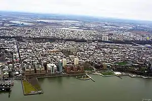 An aerial view of Hoboken from above the Hudson River