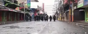 Police marching on the street during the protests