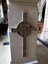 Grave marker mounted on the monument