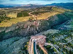 Water flows from the open Canal of the National Water Carrier of Israel into the inverted siphon in Nahal Amud and to the open canal on the other side