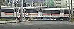 An 8300 class coach at Dela Rosa crossing.