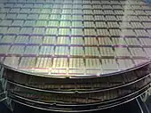 Semiconductor wafers, showing IPtronics designed ICs for parallel optical interconnects using a STMicroelectronics fabrication process