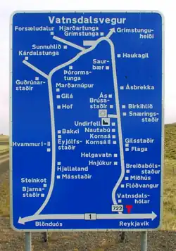 An Icelandic road sign, with detailed directions to nearby farmsteads.