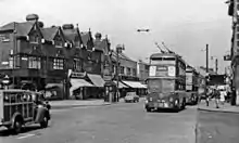 Two west-bound trolleybuses in Romford Road, Ilford, in July 1955.