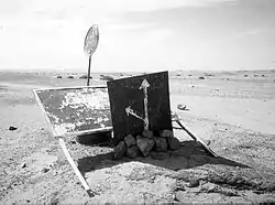 Important old sign 95km south of Tamanrasset on the main southbound In Guezzam route, indicating the fork heading ESE for I-n Azaoua well.