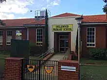 Brick school building with glass entrance doors