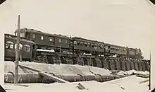 An interurban train crosses a temporary trestle built after the hurricane