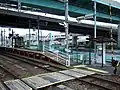 Close up of the level crossing and ramp leading to a platform.