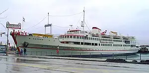 ... opposite Captain John's floating restaurant on Queens Quay