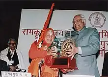 Rambhadracharya being presented the Vani Alankarana Puraskara