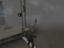 A screenshot from a video game. On the corner of a foggy street, a monster with no arms faces a man in a green jacket wielding a pipe.