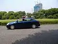 Imperial Guards in a patrol car within the gardens of the Imperial Palace in Tokyo