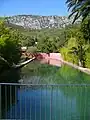 Spring-fed basin in the Domaine de Baudouvin