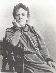 1880s sepia image of a woman reclining in a chair