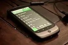 Image 12A smartphone displaying playlists on Spotify, 2010. The streaming service became a dominant and redefining platform for music consumption through the decade. (from Album era)