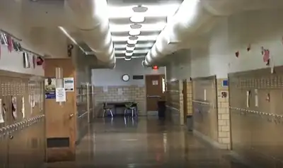 The main hallway of the Harvey Street School. While in this location, classrooms were to the left and right proceeding down the hallway, with the office being the first door on the right, and the special education classroom being the first door on the left.