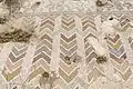 Tell Mar Elias, mosaic with chevron and floral pattern