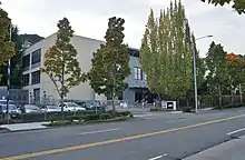 A three-story building with KCPQ and KZJO logos on a sign outside