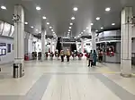 Fare gates at the LRT station concourse level.