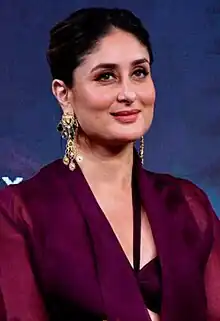 Kareena Kapoor Khan is smiling away from camera.