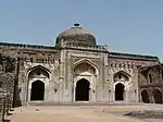 Khairul Manzil, a mosque and later a madarsa built by Maham Anga, stands opposite Purana Qila.