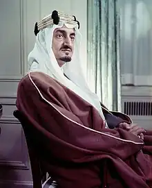 Photograph of Faisal, seated, facing right