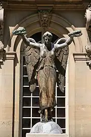 Statue of "Victory" or "Immortality" by Louis-Simone Boizot (1806-1808), originally on Place du Châtelet, now on the facade of the museum