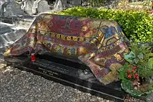 Tomb of Rudolf Nureyev draped in a mosaic oriental carpet sculpture.