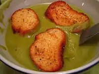 Large croutons in a soup.