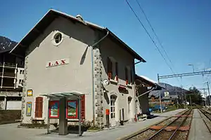 Two-story stone building with gabled roof