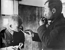 Kirpichnikov lighting the cigarette of Karl Lennart Oesch