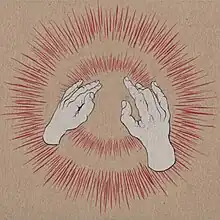 Two human hands making gestures in front of exploding red lights on a brown background.