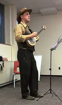 Lil' Rev, with his Mya-Moe resonator ukulele teaching a class.