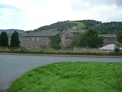 Buildings originally built as Llanfyllin workhouse, a state-funded home for the destitute which operated from 1838 to 1930.