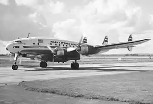 A Trans World Airlines L-749A at London's Heathrow Airport. Note the "Speedpak" removable freight container beneath the fuselage.