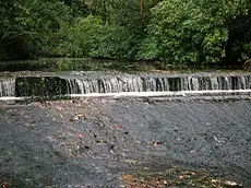 A weir on the Lugton Water near the suspension bridge.