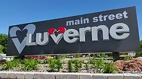 Sign saying main street LUVERNE. The V in Luverne is a heart and which is repeated before the word.