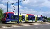 Sideways view of tram 06 in original livery