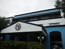 The façade of the station which is holding the old logo and the acronym at the top.