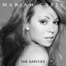 Black and white picture of Mariah Carey against a clear background with "Mariah Carey" written on top and "The Rarities" over her shoulder.