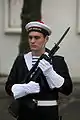 A sailor of the Ballistic Submarine Squadron presenting arms with his FAMAS-G2